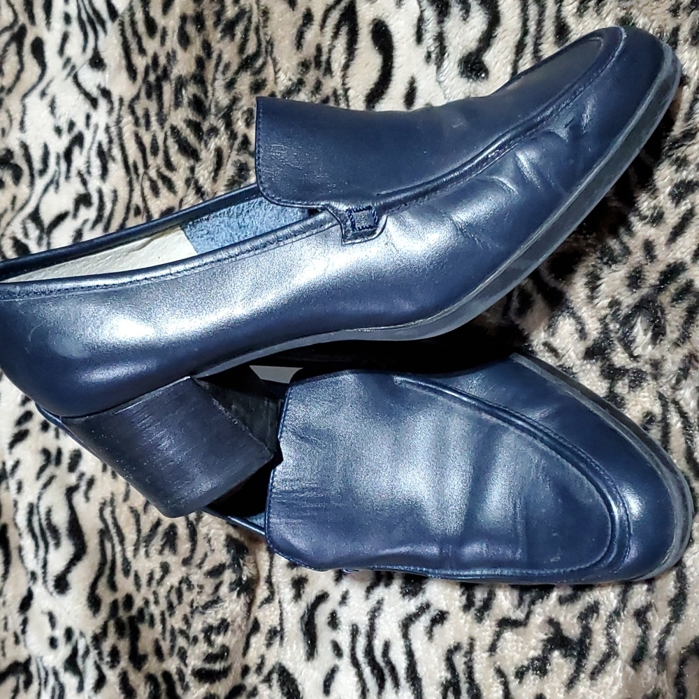 Navy blue leather wedge shoes.